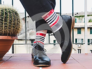 Men`s legs, stylish shoes and colorful socks