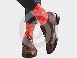 Men`s legs, trendy shoes and bright socks