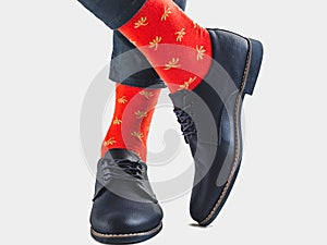 Men`s legs, trendy shoes and bright socks