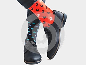 Men`s legs, trendy shoes and bright socks