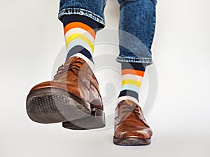 Men`s legs, trendy shoes and bright socks