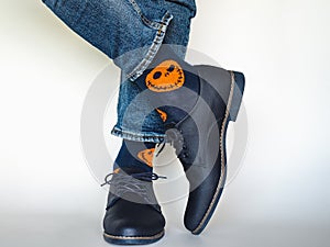 Men`s legs, trendy shoes and bright socks