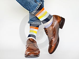 Men`s legs, trendy shoes and bright socks