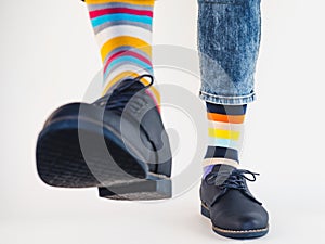 Men`s legs, trendy shoes and bright socks