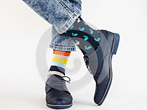 Men`s legs, trendy shoes and bright socks