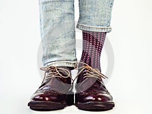 Men`s legs, trendy shoes and bright socks