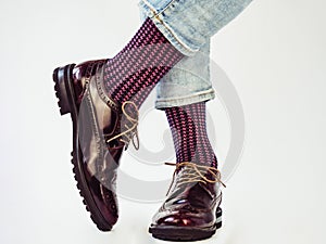 Men`s legs, trendy shoes and bright socks