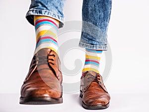 Men`s legs, trendy shoes and bright socks