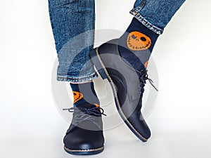 Men`s legs, trendy shoes and bright socks