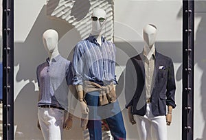 Men`s mannequins in the window of a luxury store