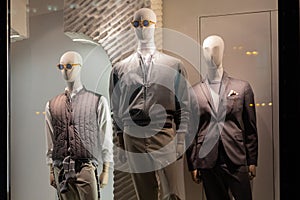 Men`s mannequins in the window of a store