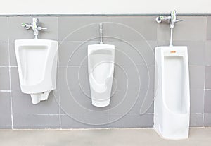 Men`s room with white porcelain urinals Old man urinals, Baby urinals  in line