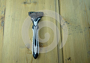 Men`s shaver with a replaceable cartridge on the table