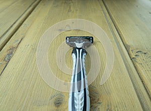 Men`s shaver with a replaceable cartridge on the table