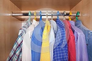 Men's shirts in the closet.