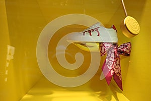 Men's shoes and accessories, shop window on a yellow background. Fashionable men's clothing.