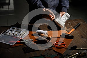 Men`s shoes made of leather leather, the shoemaker workshop. shoemaker performs shoes