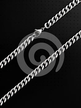 Men\'s silver chain on a black background