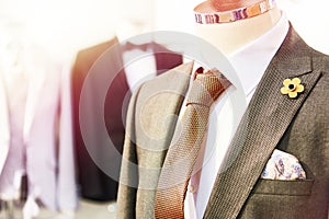 Men`s suits with shirts and ties in store