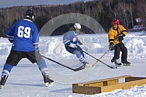 Men`s teams compete in a Pond Hockey Festival in Rangeley.