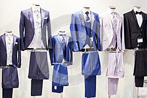 Men suits with shirts and ties in store