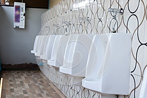 Men`s white urinals design, Close up row of outdoor urinals men public toilet