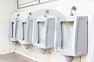 Men`s white urinals design, Close up row of outdoor urinals men public toilet