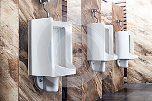 Men`s white urinals design, Close up row of outdoor urinals men public toilet