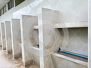 Men`s white urinals design, Close up row of outdoor urinals men public toilet