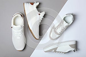 Men's and women's sneakers on a colored background top view. Sport shoes.