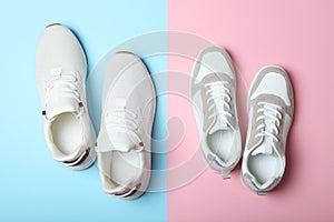 Men's and women's sneakers on a colored background top view. Sport shoes.