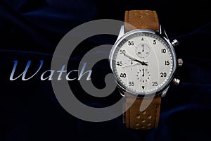 Men`s wrist watch with brown leather strap closeup