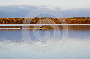 Men sailing in the lake