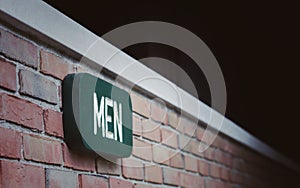 Men sign on brick wall photo