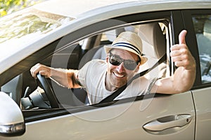 Men sitting in a rental car on holiday vacancy