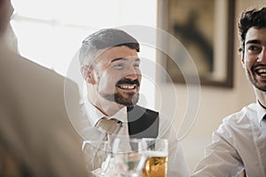 Men Socialsiing At Wedding Reception