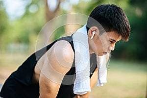 Men stand and bow and rest after exercising on the roadside