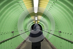 Men standing in tunnel