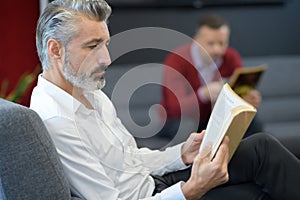 Men studying script for audition photo