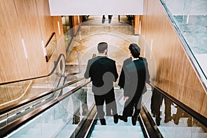 4 men in suit in the shopping center or buisnes center.