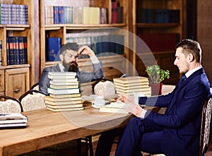 Men in suits, aristocrats, professors in library or vintage interior