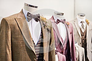 Men suits with shirts and ties in store