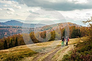 Men trekking in autumn Beskidy