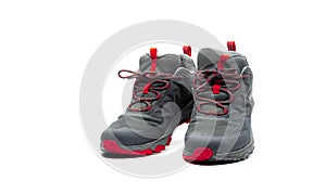 Men trekking shoes isolated on white background. Gray-red hiking shoes. Safety footwear for climbing. Adventure gear. Lightweight