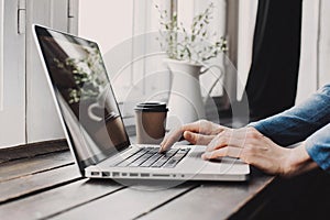 Men typing on computer keyboard. Businessman using laptop in the office. Online internet marketing concept