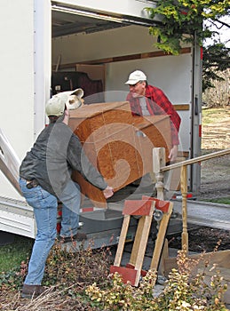 Men unload a moving van