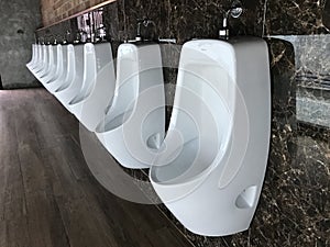 men urination bowl in men public toilet