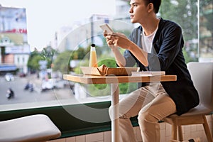 Men use phone on tea time,using mobile smart phone, Internet of things lifestyle with wireless communication and internet with