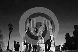 Men walk in front of Notre-Dame de Paris - CATHEDRAL - PARIS - CHURCH