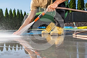 Men Washing His Swimming Pool Composite Made Deck